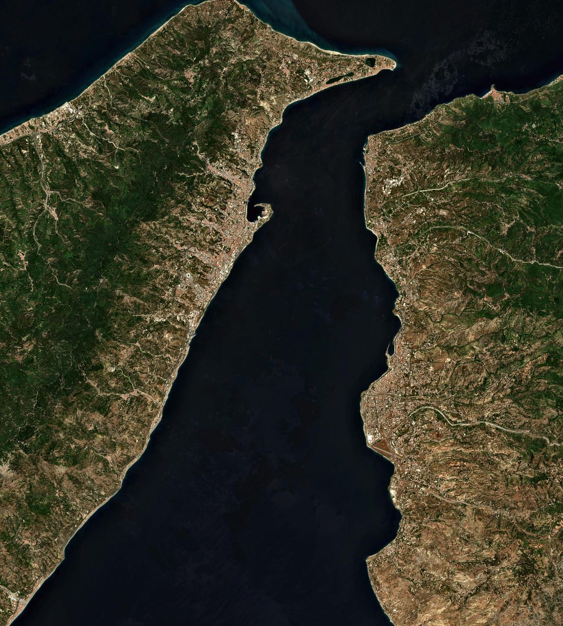 Satellite view of the Strait of Messina, with Sicily on the left and Calabria on the right, the sickle of Messina harbour at the centre and Capo Peloro at the top
